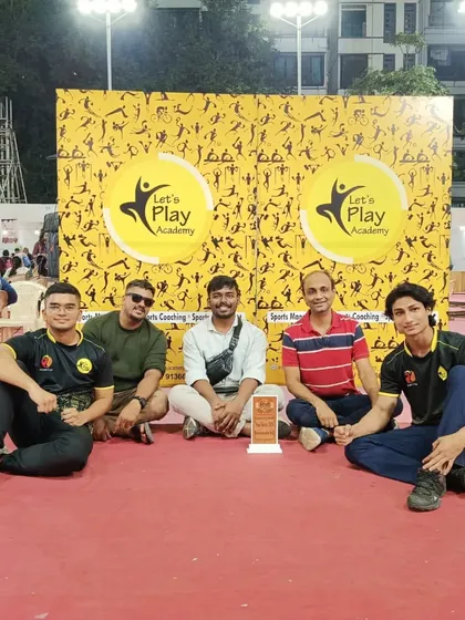 The coaching team sitting proudly with our award at the MCF Fun Fiesta. Moments like these motivate us to keep pushing the boundaries of sports and community engagement.