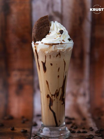 Indulge in the perfect harmony of flavors with our Cookie and Crumble shake. It's the ideal treat to cozy up with on a rainy day.