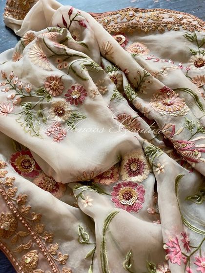 Another close-up of the floral embroidery on the sheer organza fabric.