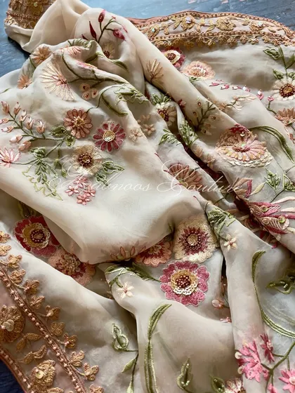 Another close-up of the floral embroidery on the sheer organza fabric.