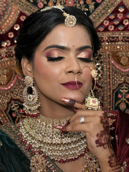 A beautiful bridal portrait with soft, shimmery eye makeup and elegant jewelry, created by me.
