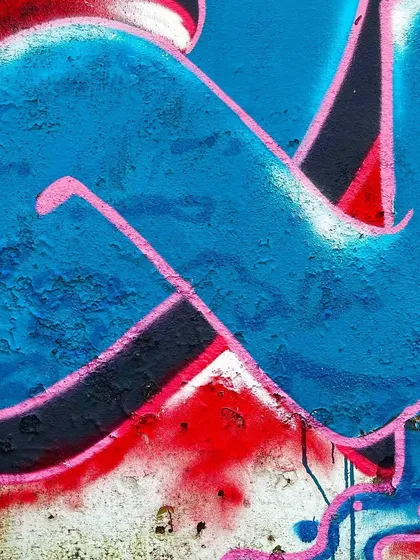 Another detailed shot of the lettering in the Shiva piece. You can see the rough texture of the wall and how the spray paint interacts with it, creating an authentic, weathered look that feels part of the environment.