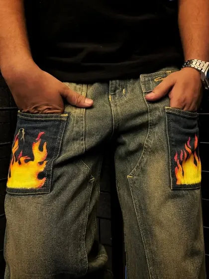 Sometimes a small detail makes a big impact. I added these bright, fiery flame designs to the front pockets of a pair of denim jeans, giving them an edgy and personalized touch without covering the whole garment.