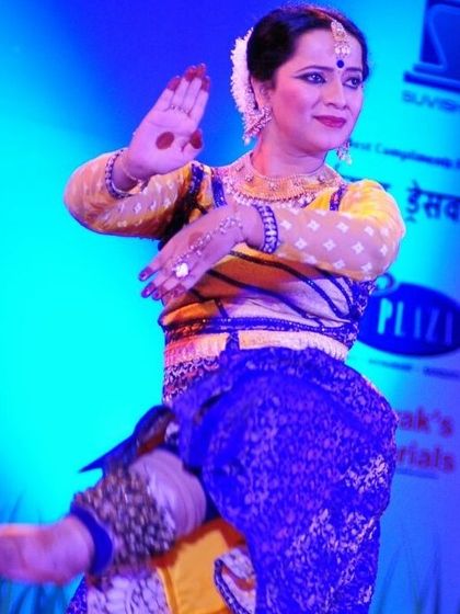 An accomplished Kathak dancer performing with intricate footwork, highlighted by the ghungroos. Our curriculum includes the study of different gharanas and their unique stylistic elements.