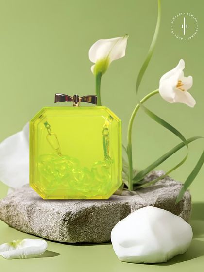 A vibrant pop of color. This transparent neon yellow box clutch is bold, modern, and playful. It's a great way to add an unexpected twist to your outfit.