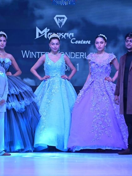 A close-up of the final lineup, with me and the show director surrounded by the stunning blue and lavender gowns.