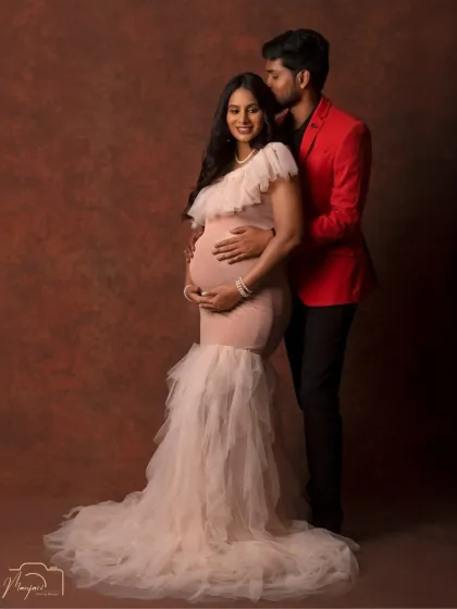 A classic and loving pose. The partner's gentle embrace from behind shows support and affection in this beautiful studio portrait with the cage setup.