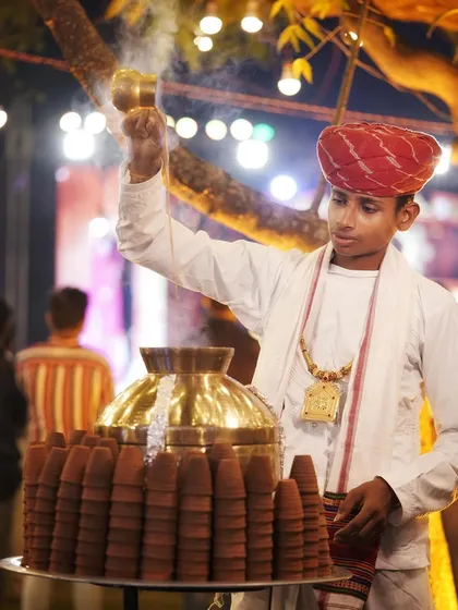 Another view of our traditional chaiwala in action, pouring tea with skill and flair. This adds a rustic and charming element to any celebration.