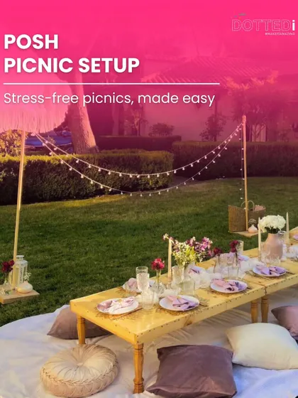 I turn simple picnics into posh, luxurious experiences. This setup features a low wooden table, plush floor cushions, elegant place settings, and string lights, creating a comfortable and stylish outdoor lounge for any celebration.