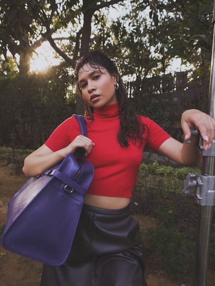 The Carryall bag in Parisian Blue, a rich, off-beat hue that adds a fresh twist to fall. Its spacious design is made to carry all your essentials and then some.