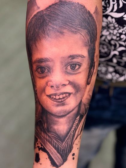 A final look at the completed portrait tattoo. Capturing a loved one's memory in ink is an honor, and I pour my heart into every detail.