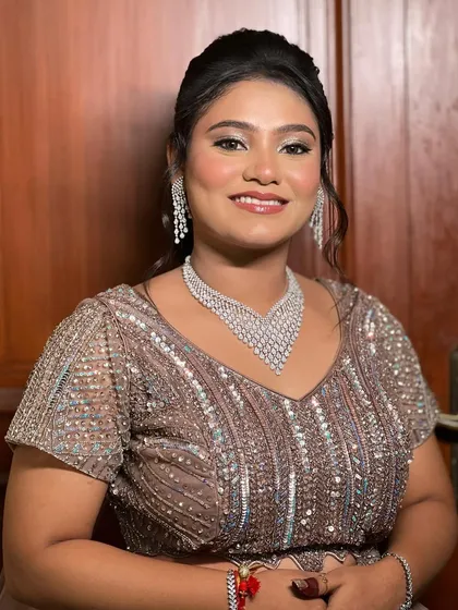 A smiling portrait of the bride, looking happy and ready for the party.