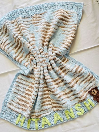 The knitted cuddle blanket is so soft and squishy. It’s the perfect warm hug for a baby. The heavy quality of the wool makes it a premium keepsake.