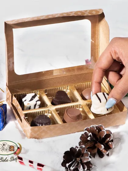 A gift box of our assorted soft-centered chocolates, perfect for Christmas. Flavors include hazelnut, coconut, butterscotch, and more.