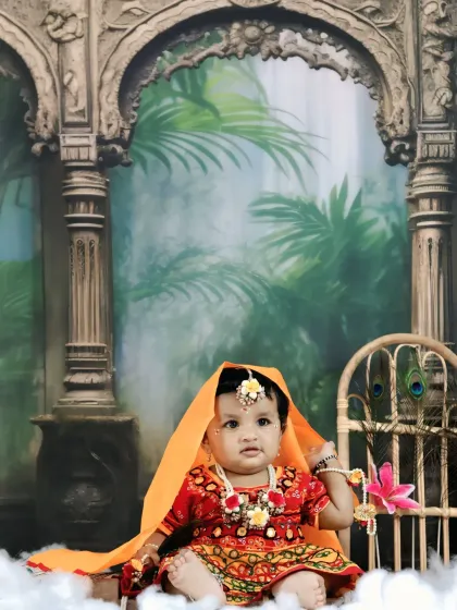A beautiful portrait of a baby girl dressed as Radha, with a gentle expression and traditional attire.