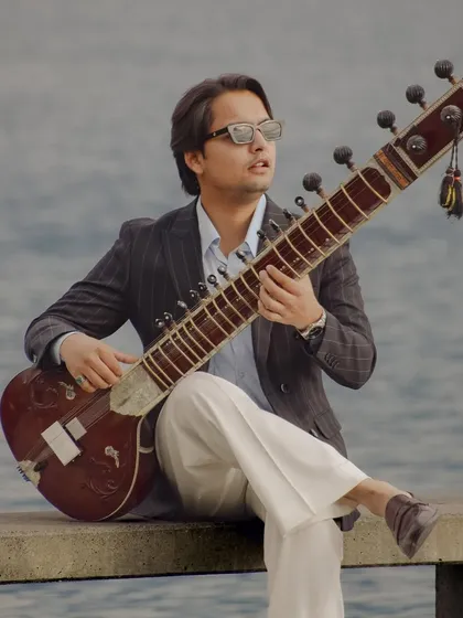 By the water in Lausanne, Switzerland. The scenery of my travels provides a beautiful backdrop for both my music and my style.