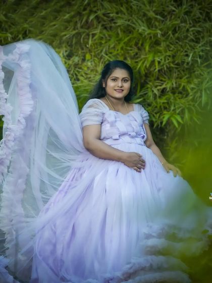 An ethereal solo portrait in a lavender gown with a dramatic, flying train. I use natural settings and creative posing to make you look and feel like a goddess.