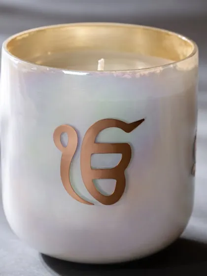 This 'Ek Onkar' candle from my spiritual collection is designed for meditative moments. The exquisitely fragranced candle helps facilitate inner peace and clarity, turning your space into a tranquil sanctuary.