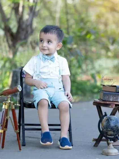 Ready to explore the world. My explorer-themed sessions, complete with a vintage telescope and globe, are perfect for capturing the adventurous spirit of curious little minds.