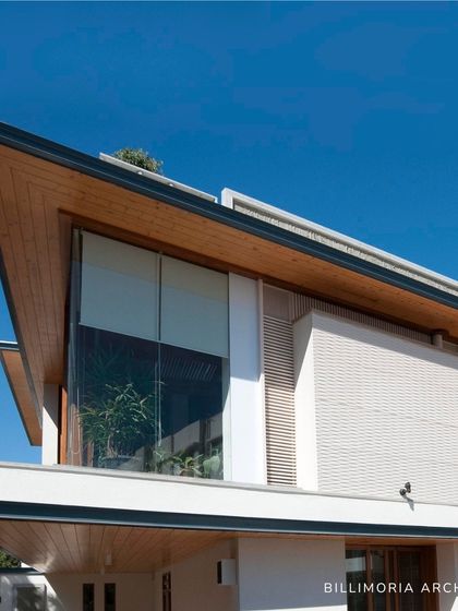 A key feature of our work is the use of angled, cantilevered roofs. This architectural element not only creates a signature look but also provides shade and frames the large glass windows that connect the interior to the sky.