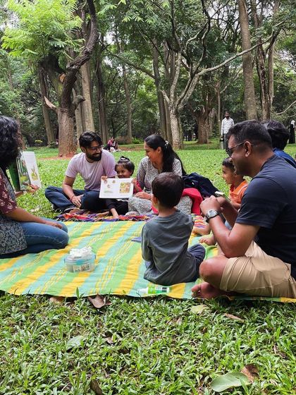 Reading 'The Gruffalo' to an eager audience. Using different voices and expressive gestures, I bring the classic characters of the deep, dark wood to life.