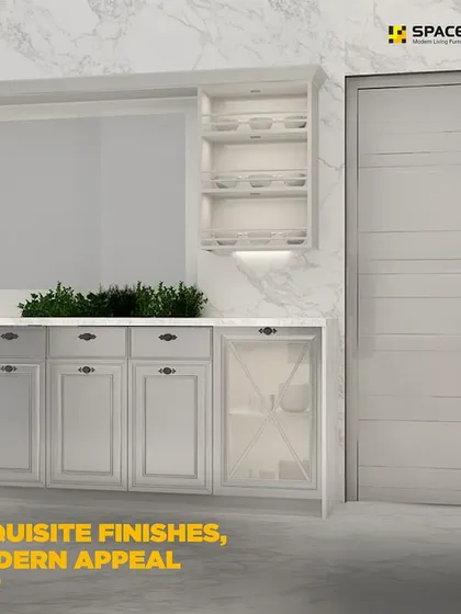This classic kitchen design features exquisite finishes and a modern appeal. The white shaker-style cabinets with glass-fronted doors are set against a marble-patterned backsplash, creating a bright and luxurious space.