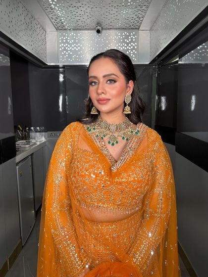 A full shot of the Roka bride in a beautifully lit corridor, looking absolutely radiant.