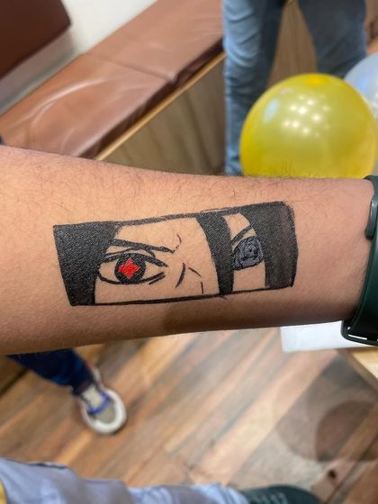 An intricate anime eye tattoo, showing the skill and detail our artists can achieve. We can cater to older kids and teens with more complex designs.