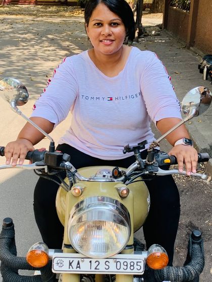The smile says it all. This is the pure joy and freedom that comes with learning to ride your own motorcycle.