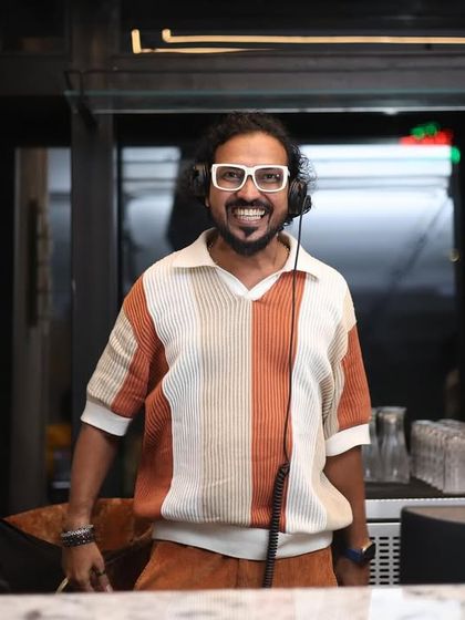 A full shot of me at the console, ready to bring the energy. This is my happy place, where I get to share the music I love.