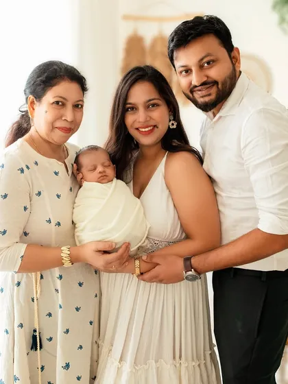 Three generations of love. Including grandparents in newborn sessions creates a priceless heirloom for the entire family to cherish.