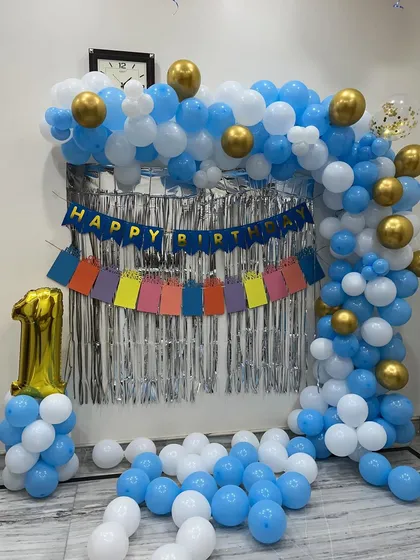 A final look at the blue, white, and gold first birthday party decor.