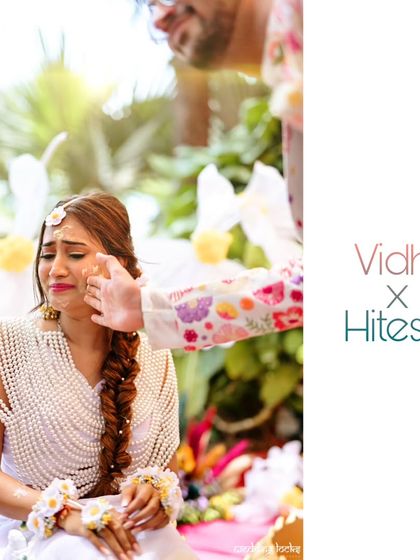 A groom's tender touch as he applies Haldi to his bride. This photo captures the mix of emotion and playfulness that makes the ceremony special.