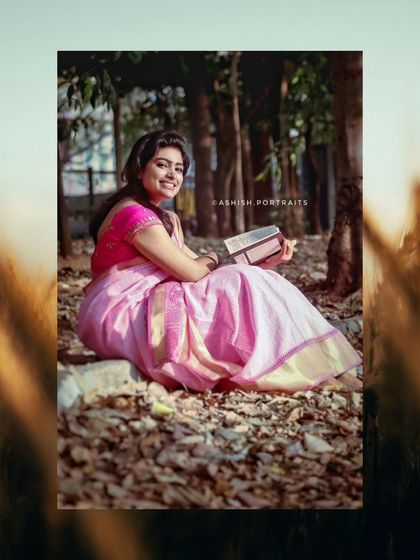 A happy, smiling shot from the pink saree series. The makeup looks bright and fresh, capturing a moment of pure joy.