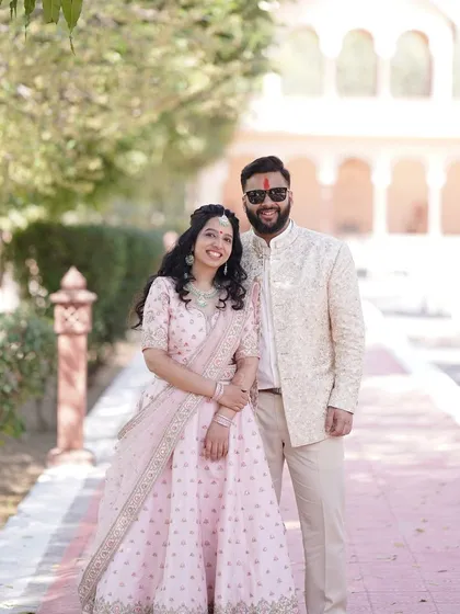 A sweet and simple portrait of the couple at their Jaipur destination wedding, dressed in beautiful pastel outfits.