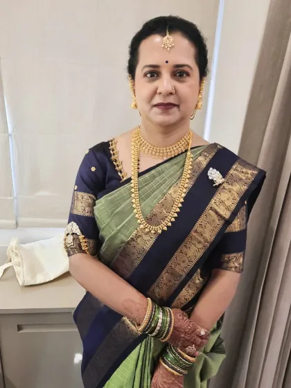 Here is the mother of the groom, looking poised and elegant for her son's Muhurtham. I applied subtle makeup that complements mature skin, focusing on a clean base and soft definition.