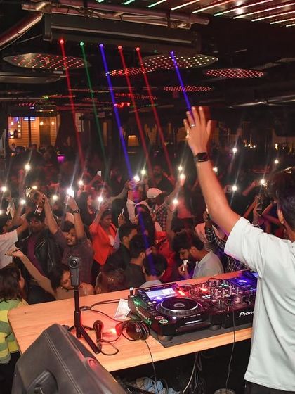 My view of the crowd at Helium, with everyone's hands in the air.