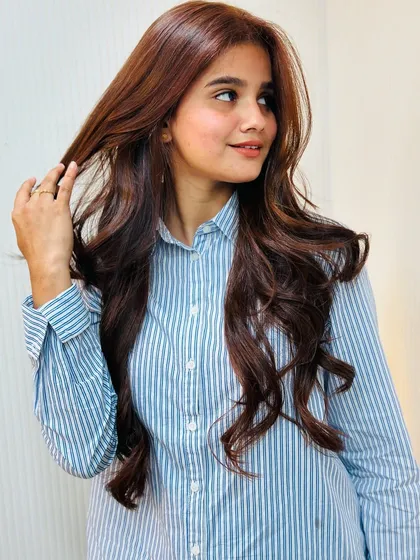 A confident pose with her new special occasion hair. The color is vibrant and the style is elegant.