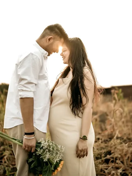A stunning silhouette of the couple touching foreheads, with the golden sun flaring perfectly between them. This is the kind of magical, romantic shot that the golden hour is famous for.