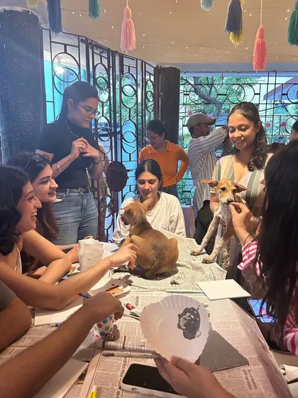 A group of participants at our Art with Shelter Puppies session in Kolkata, held at the beautiful Mrs. Wilson's Cafe.
