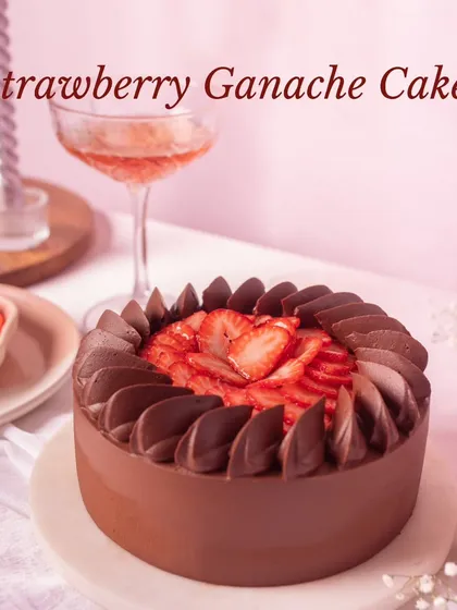 The Strawberry Ganache Cake combines rich, dark chocolate with the sweetness of fresh strawberries, decorated with elegant chocolate swirls.