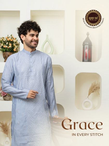 Grace in every stitch. A model in a light blue embroidered kurta, exuding a calm and graceful confidence.