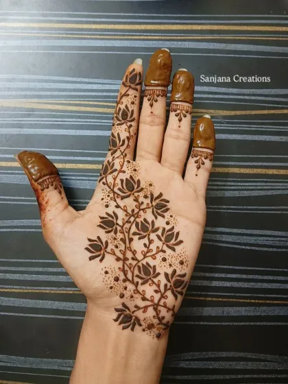 The lotus vine design with the flowers filled in, creating a beautiful contrast and depth.