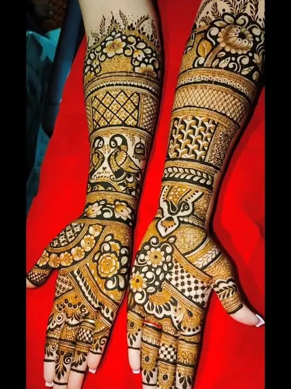 This design features lovebirds in jharokhas, surrounded by a mix of floral and geometric patterns.