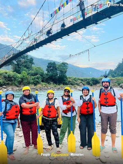 Geared up and ready for river rafting in Punakha. The suspension bridge in the background adds to the epic scenery of this thrilling adventure.