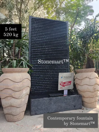 This contemporary 5-foot, 520 kg granite waterfall is a statement piece for any indoor or outdoor space. Its minimalist design and natural stone texture are perfect for modern aesthetics.