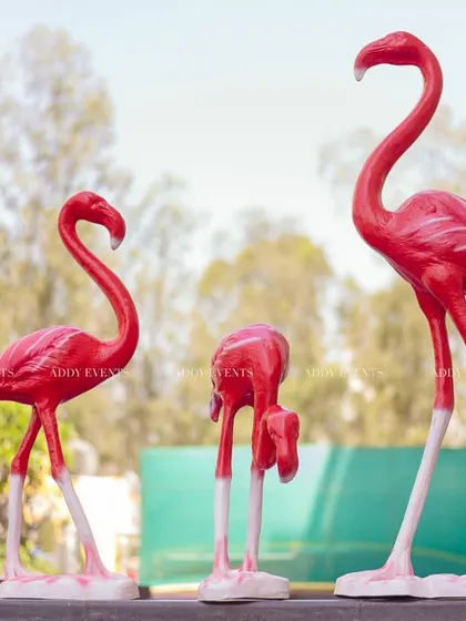 Adding a touch of tropical fun, these bright pink flamingo props were a quirky and memorable part of the Haldi decor.