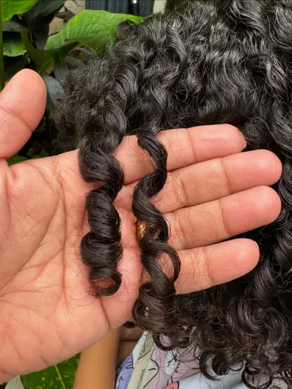 Look at that perfect spiral! A close-up of the healthy, defined ringlets after a kids' curly haircut. My goal is to enhance these natural patterns.
