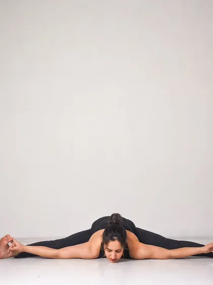 Kurmasana (Tortoise Pose), a deep forward bend and hip opener. This asana taught me patience and the power of breath to slowly and safely go deeper into a posture.