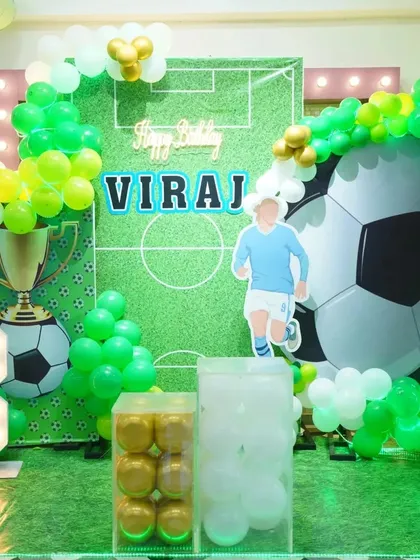 The complete football party setup for Viraj's 8th birthday, featuring a light-up number and a backdrop that makes every kid feel like a star player.